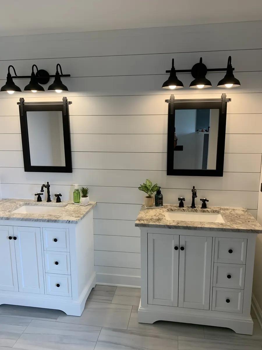 Double vanity bathroom with shiplap wall, black-framed mirrors, and granite countertops, Naperville IL