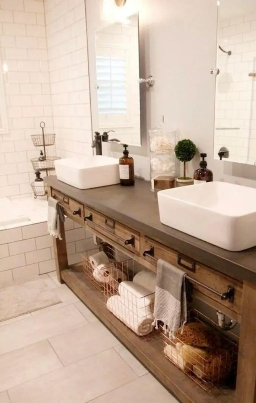 Farmhouse-style double vanity with rectangular vessel sinks, dark countertop, open shelving, and subway tile shower surround, Naperville IL