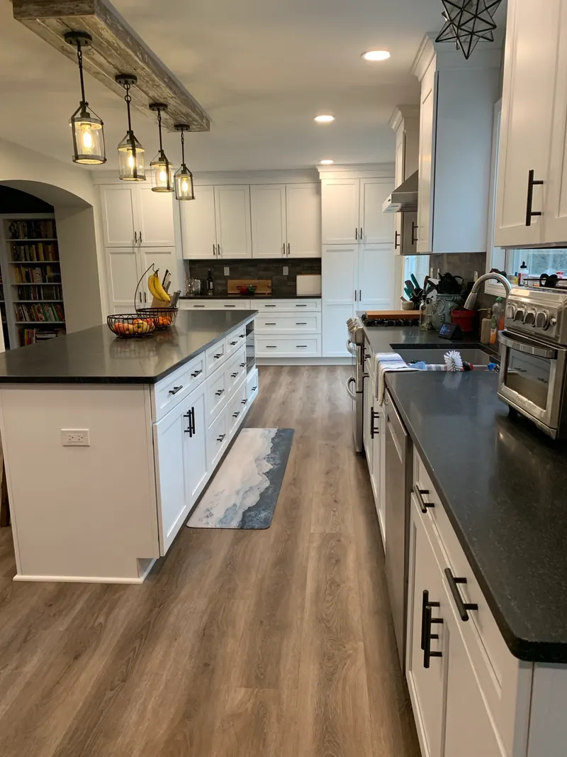 White shaker kitchen with dark quartz island and pendant lighting, Naperville IL